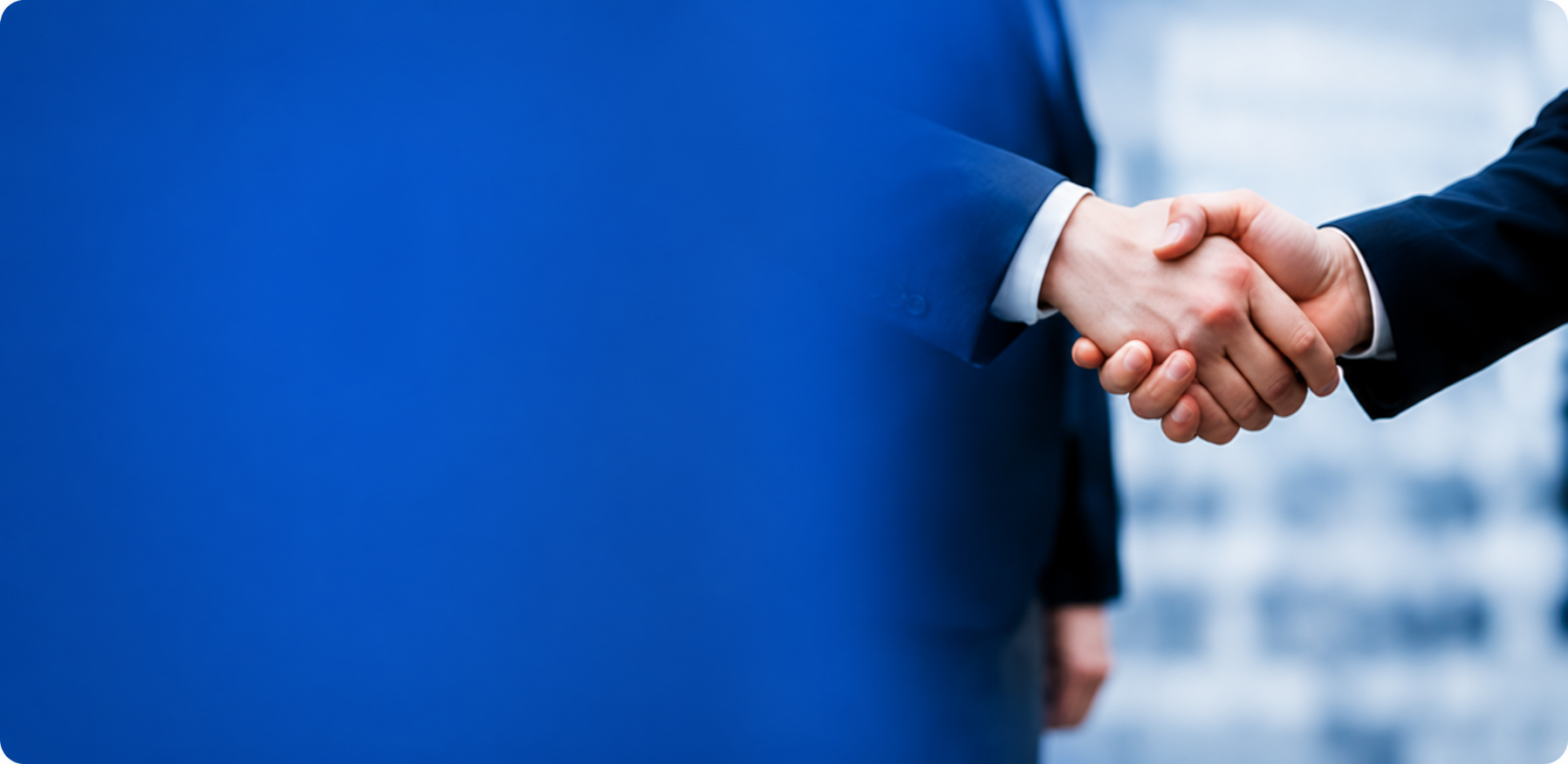 企業同士が握手している様子